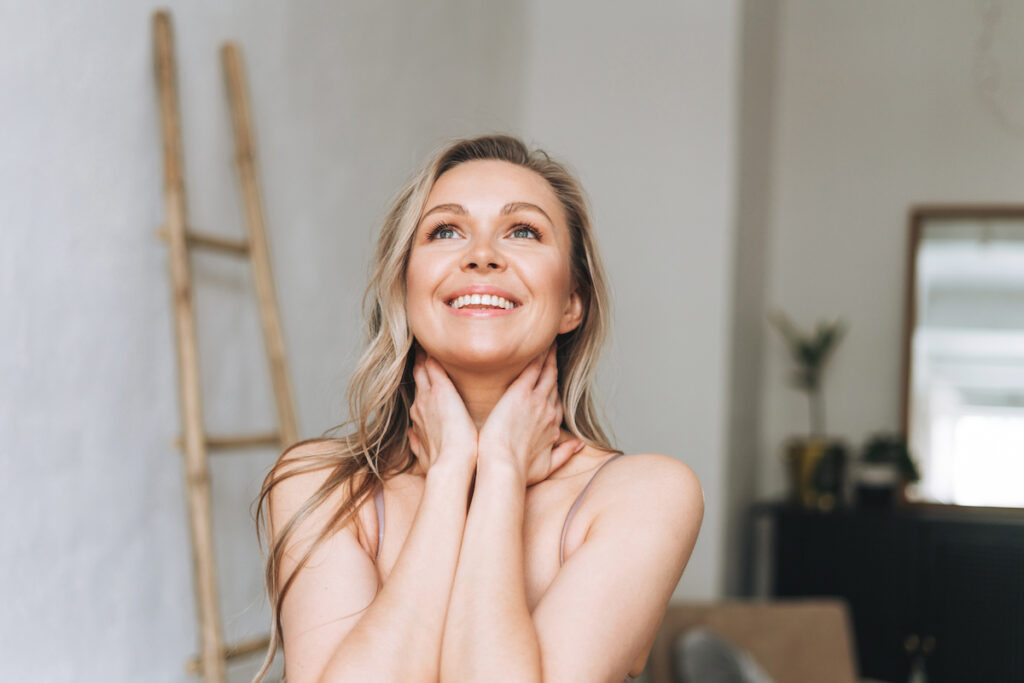 Woman looking up and loving how she looks and feels after having laser resurfacing in Philadelphia