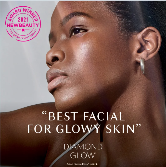 DiamondGlow Facial Close-up portrait of a woman with smooth, glowing skin after a DiamondGlow facial, illuminated by natural light.